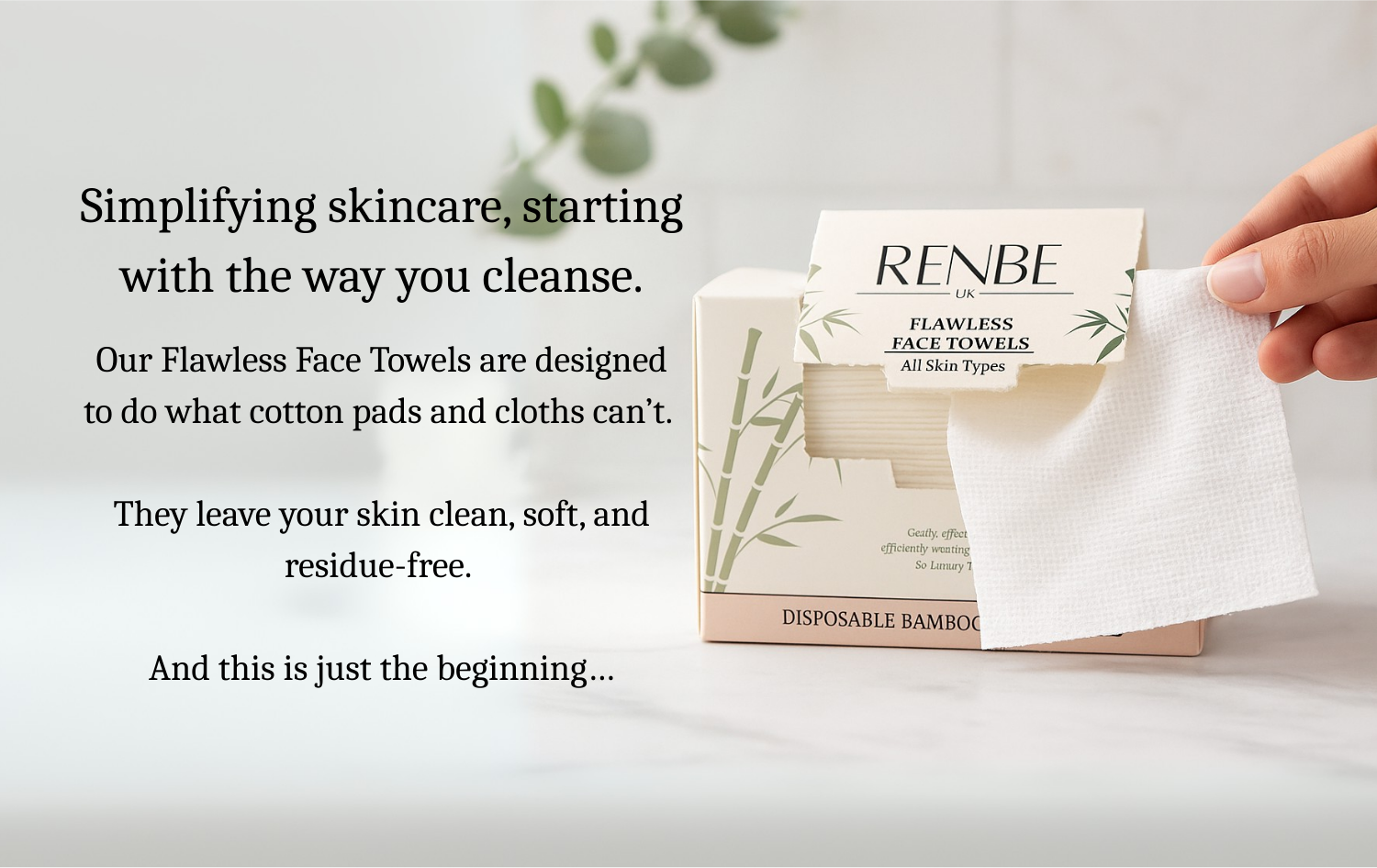 Hand pulling a bamboo face towel from a RENBE Flawless Face Towels box on a white marble bathroom counter, eco-friendly disposable skincare product.